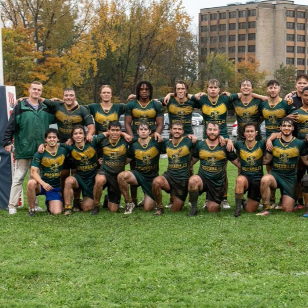 A photo of the men's rugby team after a game.